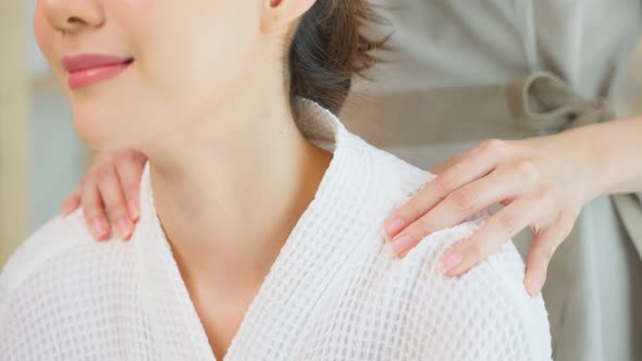 Asian young happy woman feeling relax during shoulder and back massage.