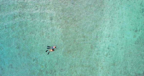 Couple snorkeling in the sea 4k
