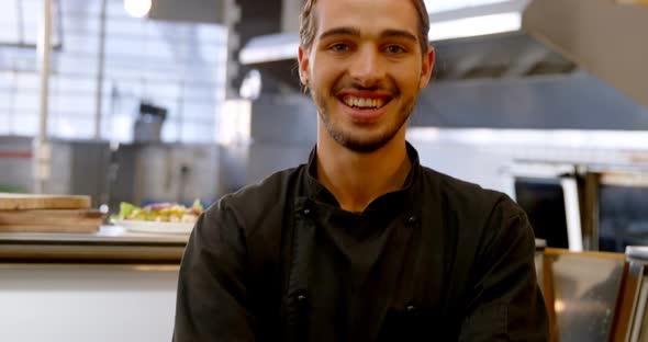 Smiling chef standing with arm crossed 4k