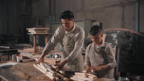 Father And Son Working With Wood