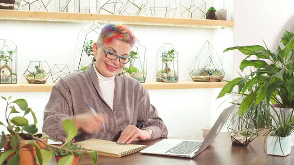 Good-looking Elderly Business Woman with Smiling Look