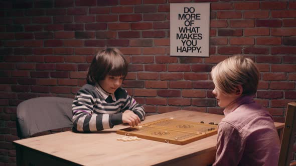 Two Boys Playing Narde