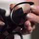 Woman Holds Eyeglasses in Hands - VideoHive Item for Sale
