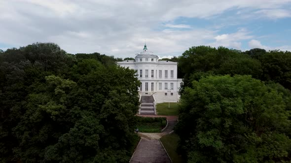 Facade of Luxury Estate with Stairs. From Below Exterior of Luxury Mansion with Staircase and Many