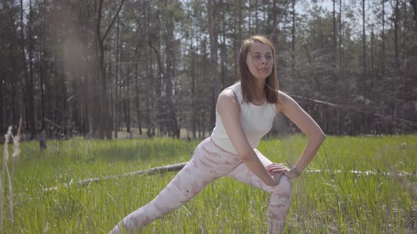 Portrait Healthy Beautiful Woman Doing Yoga Fitness Stretching in the Forest. Spectacular Nature