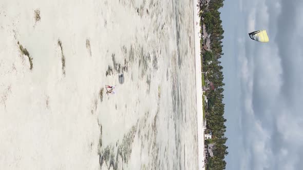 Vertical Video Kitesurfing Near the Shore of Zanzibar Tanzania Aerial View