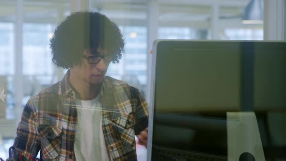 Young man working in a creative office