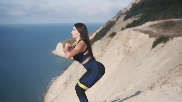 Sexy Young Sportive Woman Exercising with an Elastic Band