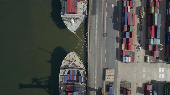 Logistic concept aerial shot of commercial maritime transport dockyard with cargo ships waiting to b