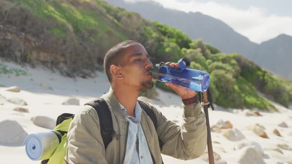 Sporty mixed race man with prosthetic leg hiking