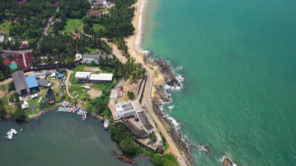 Aerial view of Beruwala Fishery Harbour along the coast, Sri Lanka.