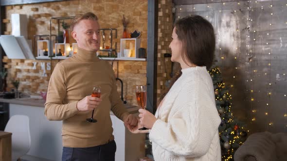 Young Couple in Love Dancing Near the Christmas Tree at Home