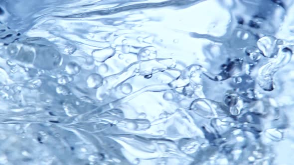 Super Slow Motion Shot of Oil and Water Blue Whirl at 1000Fps alt