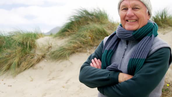 Senior man in sweater feeling cold