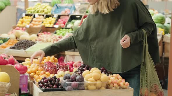 Woman Shopping for Fresh Produce at Market