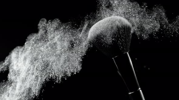 Super Slow Motion Shot of Silver Makeup Powder Falling From Facial Brush at 1000Fps