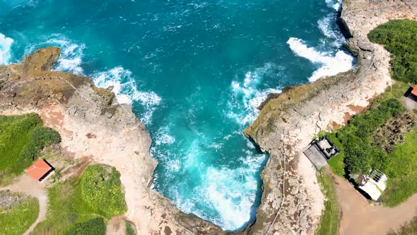 Wave breaks at Devil's Tear Nusa Lembongan