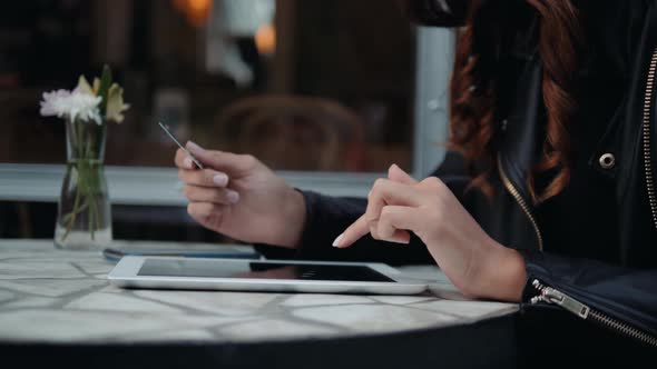 Young Woman Holding Credit Card and Using Laptop Computer