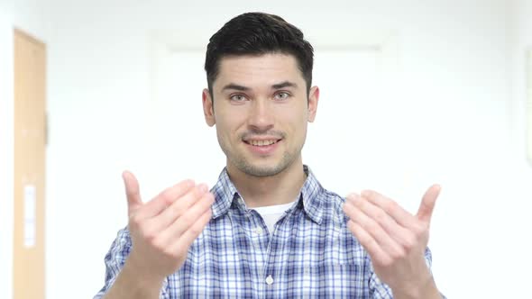 Inviting Handsome Man in Office Gesture