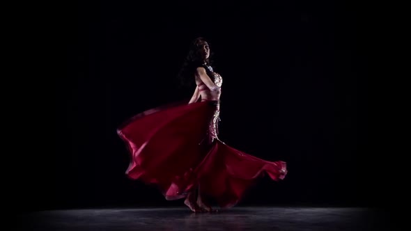 Girl Dancing in Dress . Black Background. Slow Motion