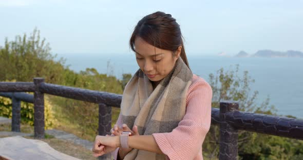 Woman use of smart watch at outdoor