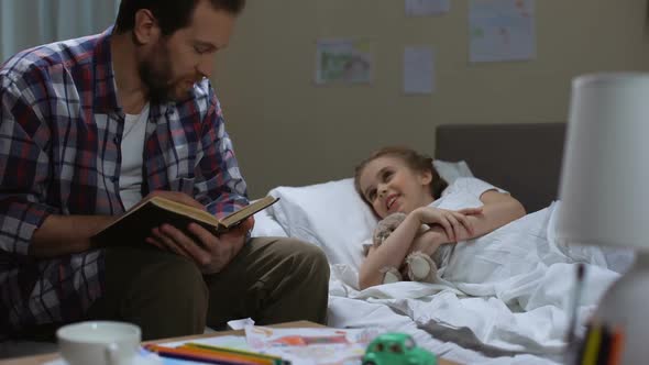 Single Father Reading Fairytale Book Daughter Before Sleep, Happy Childhood