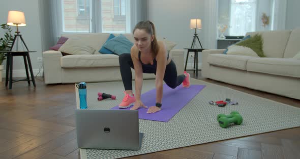 Doing Sports and Fitness Training at Home. Woman in Activewear Doing Fitness Exercises with Help of