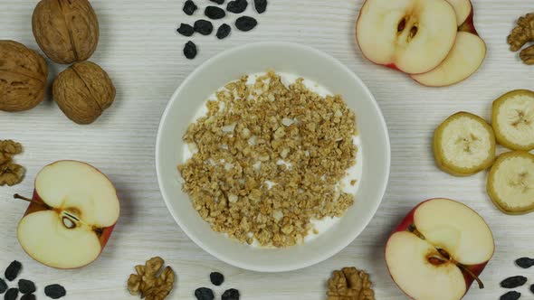 Granola with Yogurt Breakfast. Preparation and Eating. Stop Motion Animation. Top View