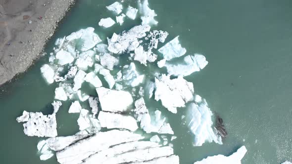 Top Down View Of Jökulsárlón Glacier Lagoon In Iceland - aerial drone shot