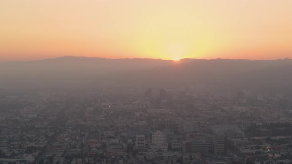 Aerial of orange sunset light on cityscape