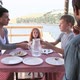Family enjoying lunch by lake - VideoHive Item for Sale