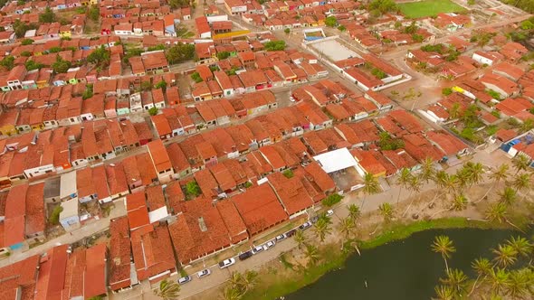 Aerial view of rooftops and small streets of Rio do Fogo town, Brazil.