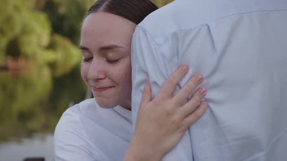 Close Up View of a Young Nurse That Hugs Illaged Man
