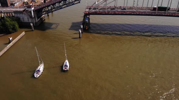 Aerial View Of Sailboats Waiting For Single-leaf Bascule Bridge To Open For Clearance Of Passage In