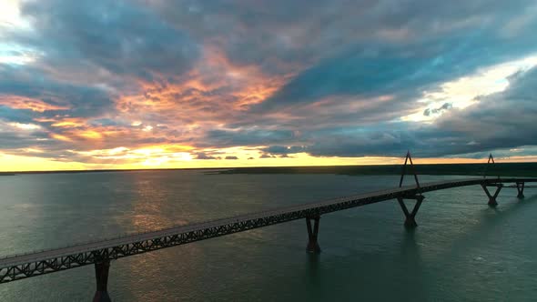 Aerial view of the sunset behind the Deh Cho Bridge, near Fort Providence Northwest Territories - Ma