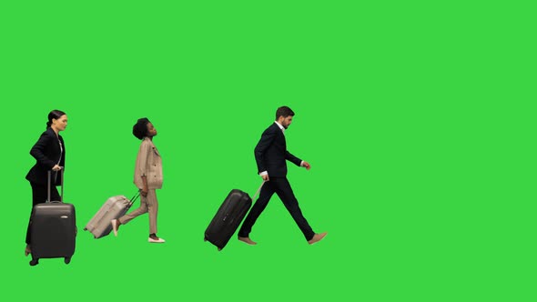 Four Diverse Business People with Luggage Checking Info Board Being Late for the Train or Plane