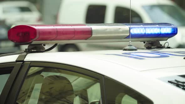 Flashing Flasher on the Roof of a Police Car. Blinker. Close-up.