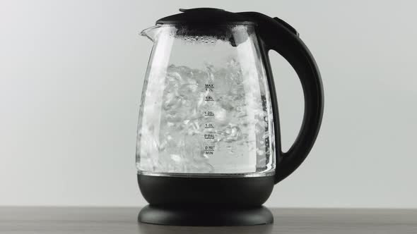 Electric Kettle with Transparent Walls. Active Boiling Water. Concept Shot
