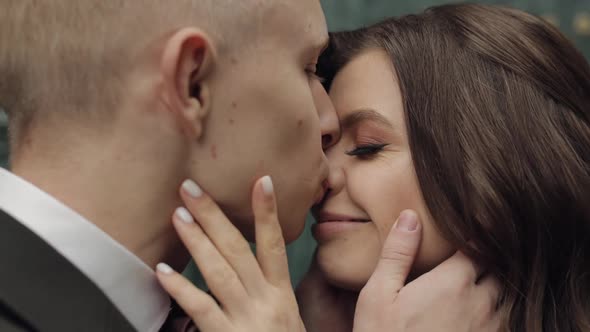 Newlyweds Caucasian Groom with Bride Walking Embracing Hugs in City Wedding Couple in Love