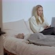 Mother Working with Laptop Near Sleeping Baby in Bedroom - VideoHive Item for Sale