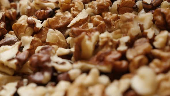 Out its shell walnut pile slow tilt  on food background 4K 2160p 30fps UltraHD   footage - Fruit ing