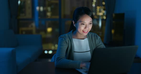 Woman use of computer at night