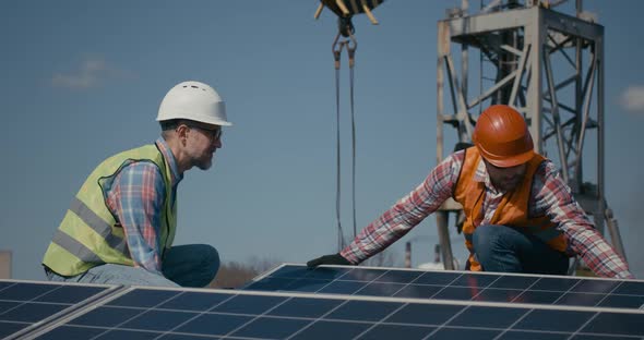 Technicians Installing Solar Panels in Sunshine