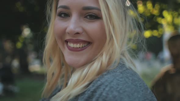 Pretty Blonde Woman Plus Size Spin Around Closeup