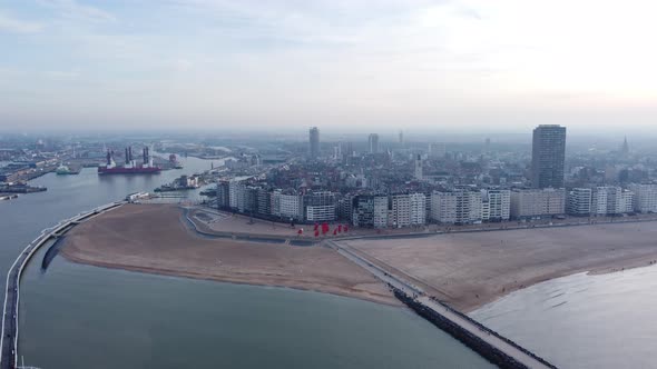 Ostend City And Beach From Oostende Pier In Belgium. - aerial forward