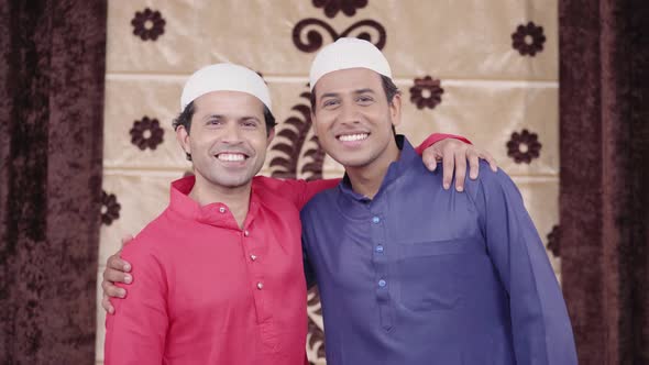 Muslim men smiling to the camera