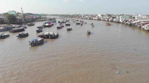 Aerial: rotating panorama over Cai Rang floating market Can Tho Vietnam