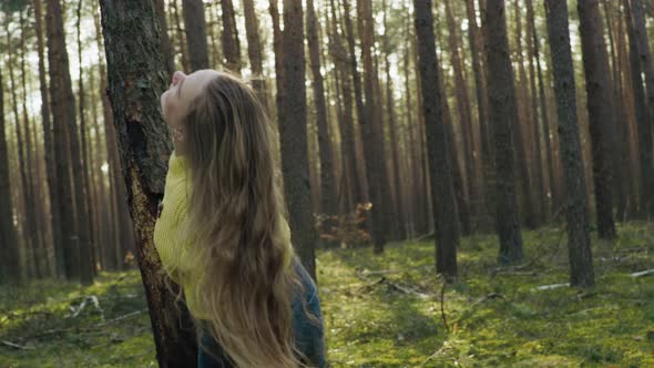 Beautiful Girl in the Forest with Long Hair Smiling