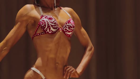 Strong Female Bodybuilder With Hypermasculine Body Demonstrating Ripped Muscles