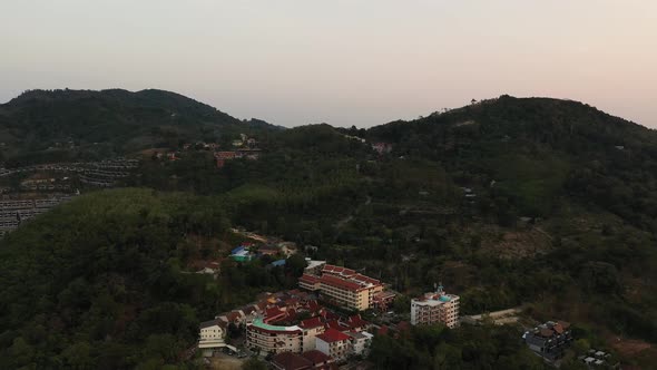 Drone Flight Over the Jungle and Sea City After Sunset
